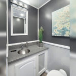 image displays the interior of a luxury portable restroom trailer